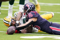 Houston Texans wide receiver Will Fuller V (15) and Green Bay Packers cornerback Jaire Alexander reach for a loose ball during the first half of an NFL football game Sunday, Oct. 25, 2020, in Houston. (AP Photo/Sam Craft)