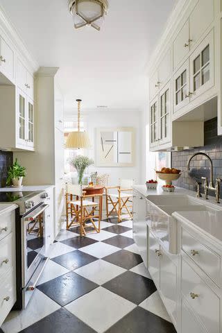 <p>HECTOR MANUEL SANCHEZ</p> Modern kitchen with a 1920s-inspired checkered floor.