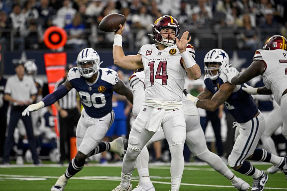 Washington Commanders quarterback Sam Howell (14) passes against the Dallas Cowboys during the first quarter at AT&T Stadium. Mandatory Credit: Jerome Miron-USA TODAY Sports