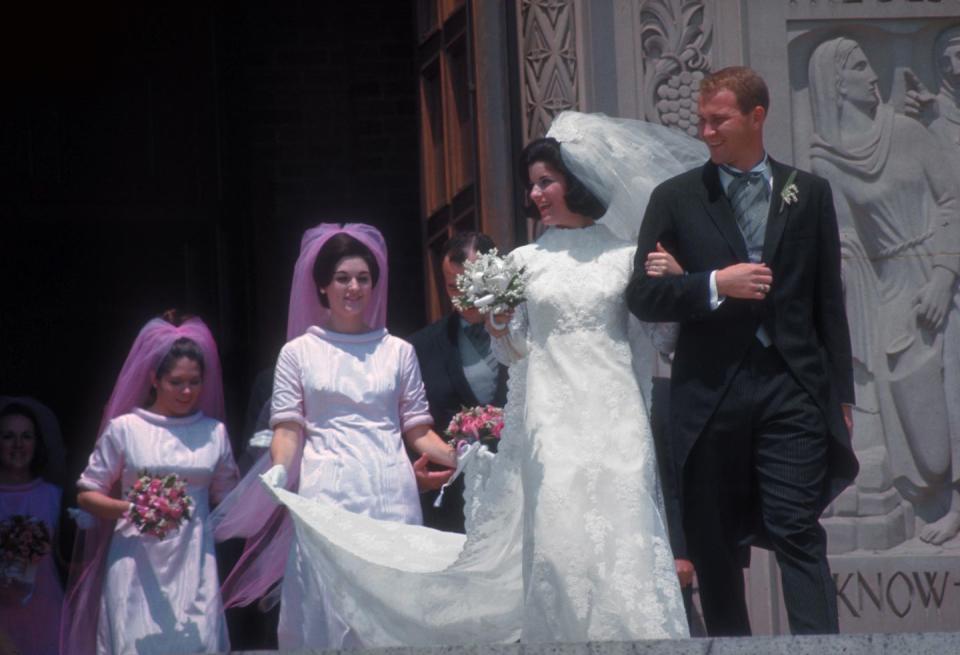 <p>Bridesmaids in the late '60s were told to think pink as the Pepto-Bismol hue gained popularity towards the end of the decade. Bonus points for a matching veil.</p>