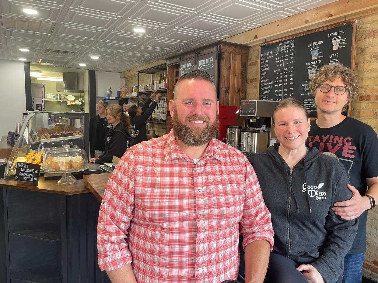 Brandon Denby, Angela Denby Belanger and Dan Belanger pose for a photo at Good Deeds Coffee Bar in Fowlerville on Monday, July 31, 2023.