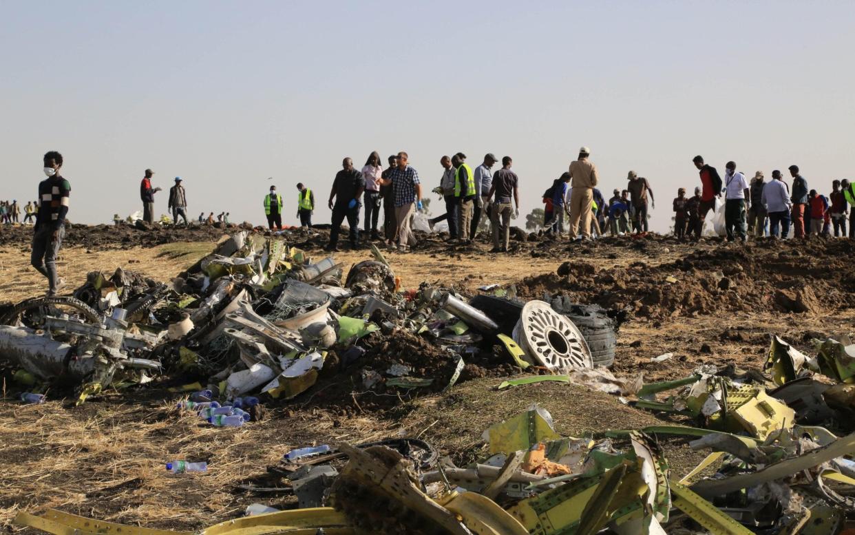 Rescuers work at the crash site of Ethiopian Airlines flight ET302 during the continuing recovery efforts - Visual China Group