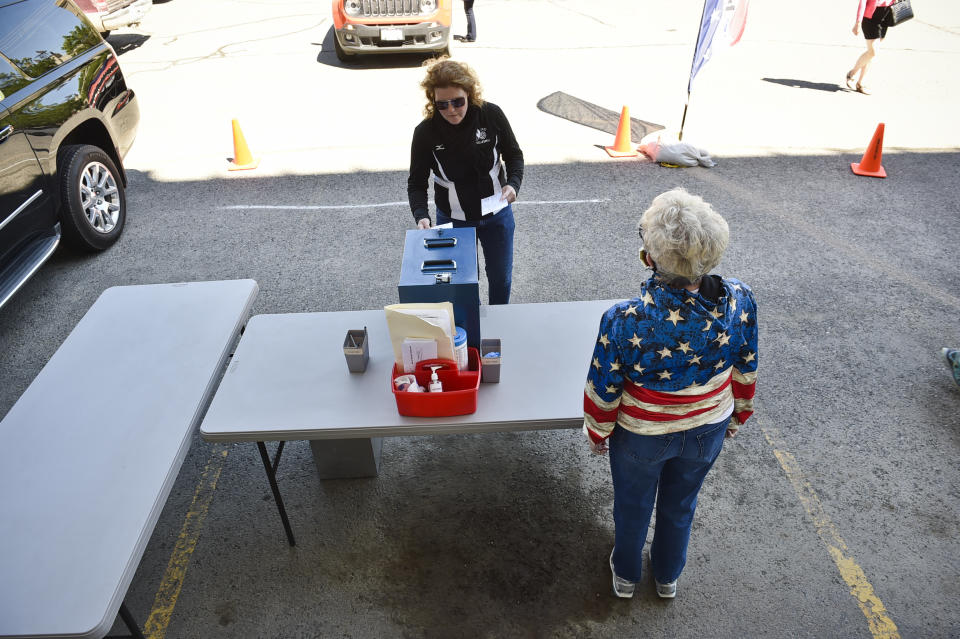 Voters drop off their ballots Tuesday outside the City-County Building during Montana's primary election Tuesday, June 2, 2020 in Helena. Montana’s June 2 primary is being held by mail because of the coronavirus. (Thom Bridge/Independent Record via AP)