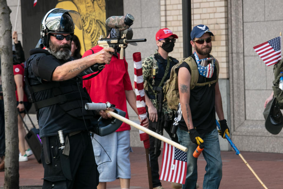 The Proud Boys, an alt-right group, faces off against Black Lives Matters protesters using mace and a paint ball gun on August 15, 2020 in downtown Portland, Oregon. Demonstrations have occurred on almost a nightly basis in Portland since the killing of George Floyd. (Paula Bronstein/Getty Images)