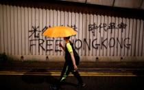 People march during a rally to demand democracy and political reforms in Hong Kong