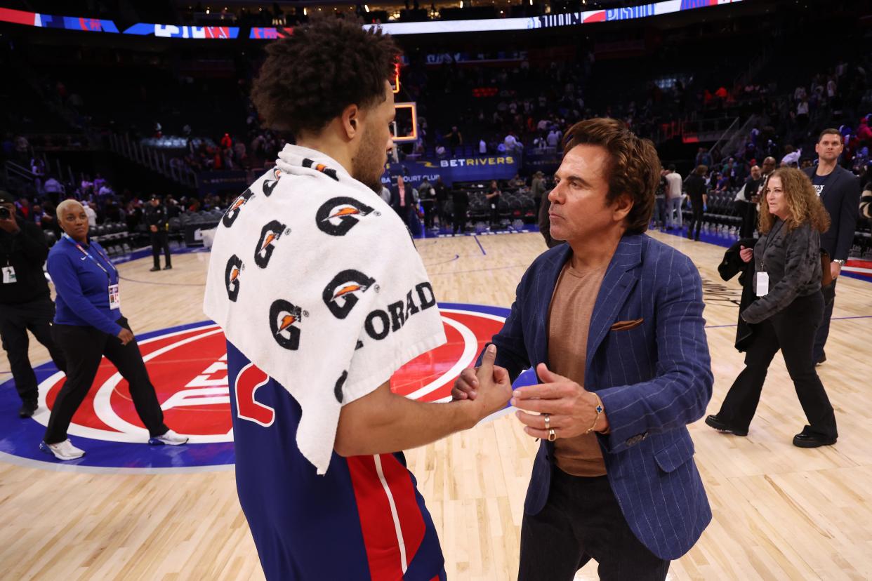 Detroit Pistons owner Tom Gores, right, talks to guard Cade Cunningham after a 118-102 win over the Chicago Bulls at Little Caesars Arena on Oct. 28, 2023 in Detroit.