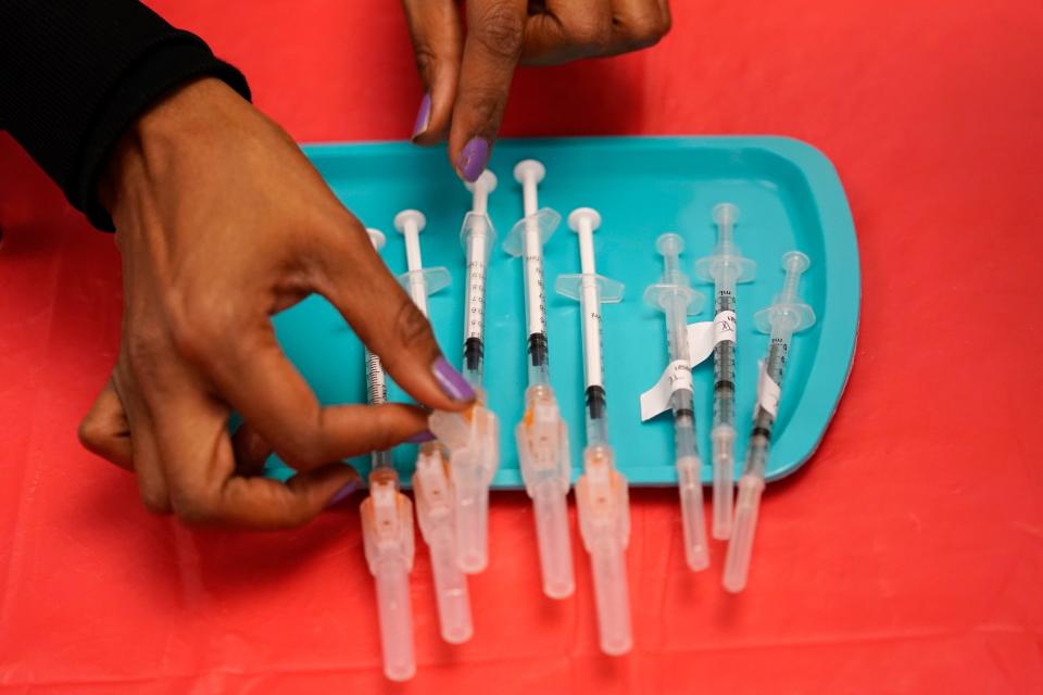 A certified medical assistant prepares doses of the Pfizer COVID-19 vaccine at a vaccination center at the University of Nevada, Las Vegas on Jan. 22, 2021.