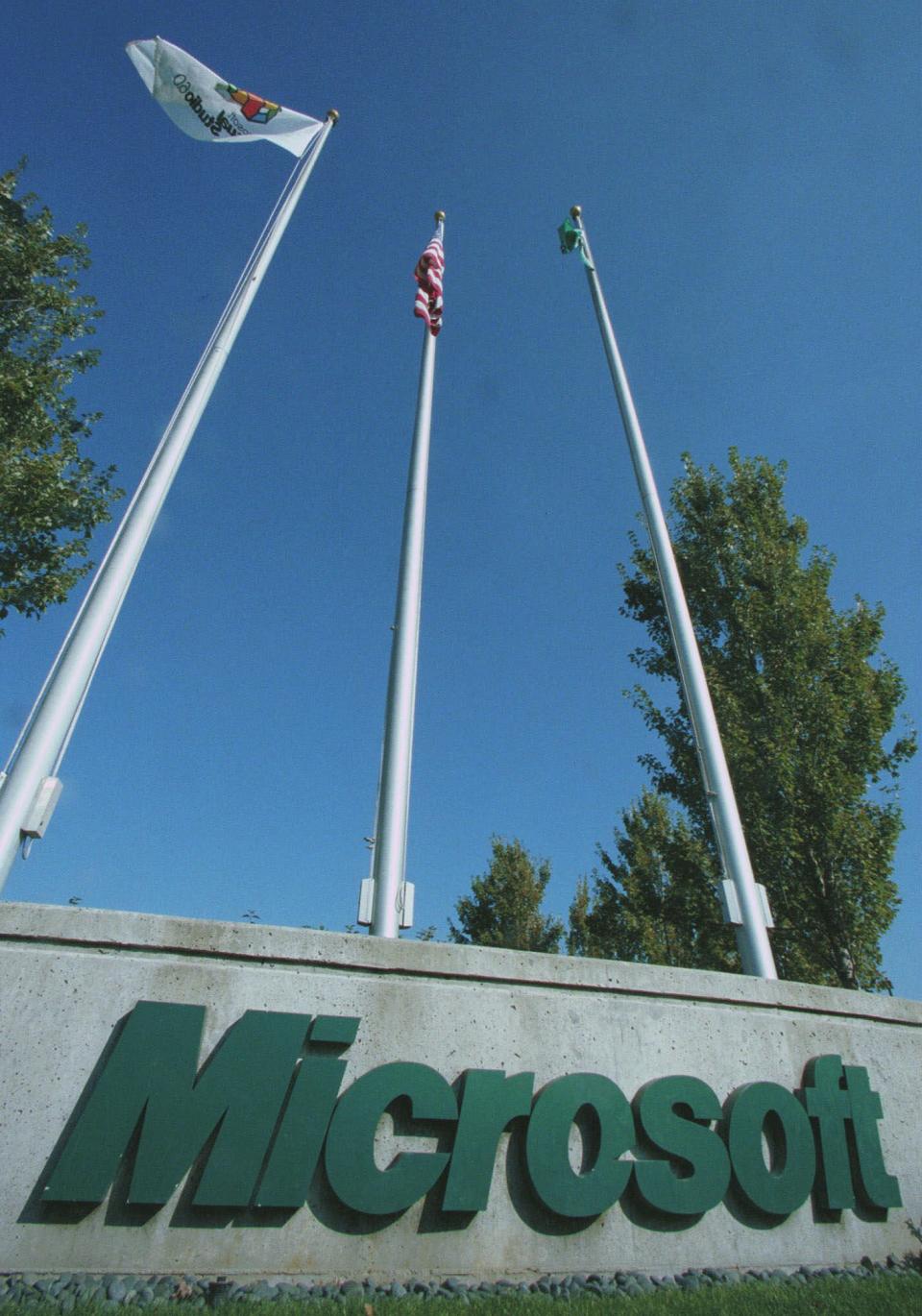 FILE - This set of flagpoles sits at one of the entrances to Microsoft Corporation in Redmond, Wash., in this Oct.19, 1998 file photo. The General Court of the European Union has upheld most of a massive fine against Microsoft Corp. by the European Commission's competition watchdog in 2008. In a ruling Wednesday, June 27, 2012, it rejected Microsoft's appeal but did cut the fine by €39 million to €860 million ($1.1 billion). (AP Photo/Joe Brokert, File)