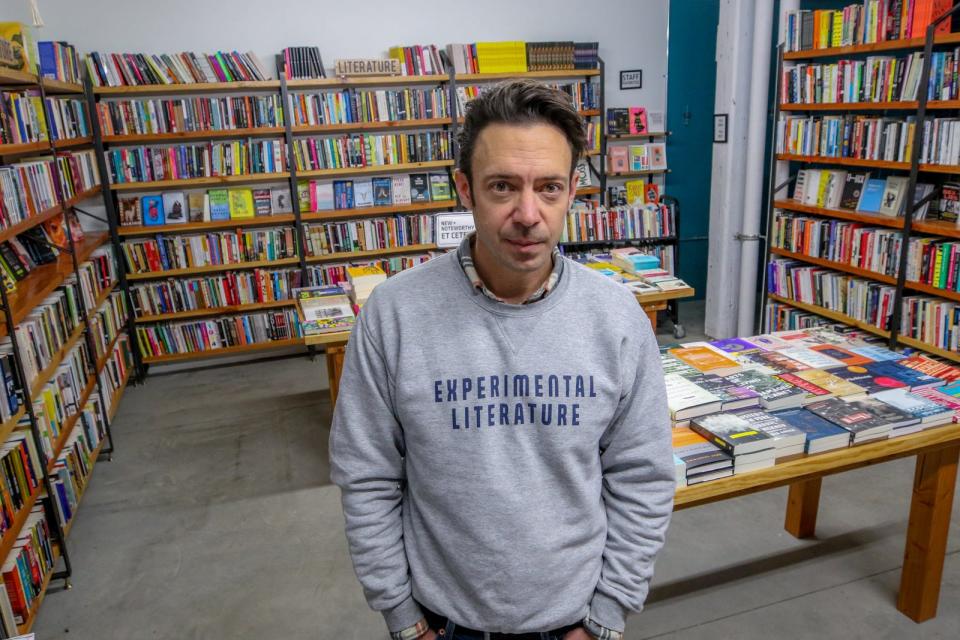Riffraff owner Tom Roberge at his bookstore-bar in 2020. He said he's looking for a buyer because his move to Switzerland is "making it increasingly difficult to maintain my connection to the store and the day-to-day goings on there."