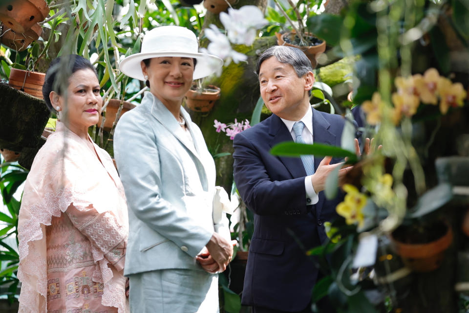 Japan's Emperor Naruhito, right, and Empress Masako, react as Indonesia's First Lady Iriana Widodo looks on during their visit at Bogor Botanical Gardens in Bogor, Indonesia, Monday, June 19, 2023. (Willy Kurniawan/Pool Photo via AP)