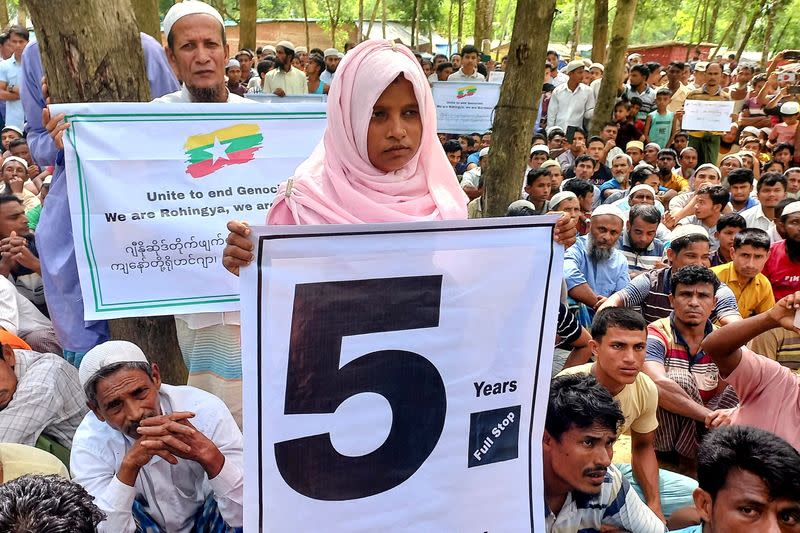 Rohingya refugees gather to mark the fifth anniversary of their fleeing from neighbouring Myanmar to escape a military crackdown in 2017, in Cox's Bazar