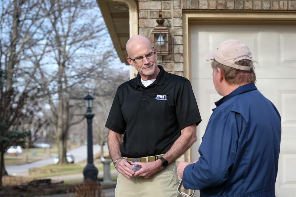 Springfield City Council candidate David Nokes speaks with resident Tom Cox about the upcoming city council election while canvassing on Tuesday, Jan. 10, 2022. Nokes is running for the Zone 3 seat.