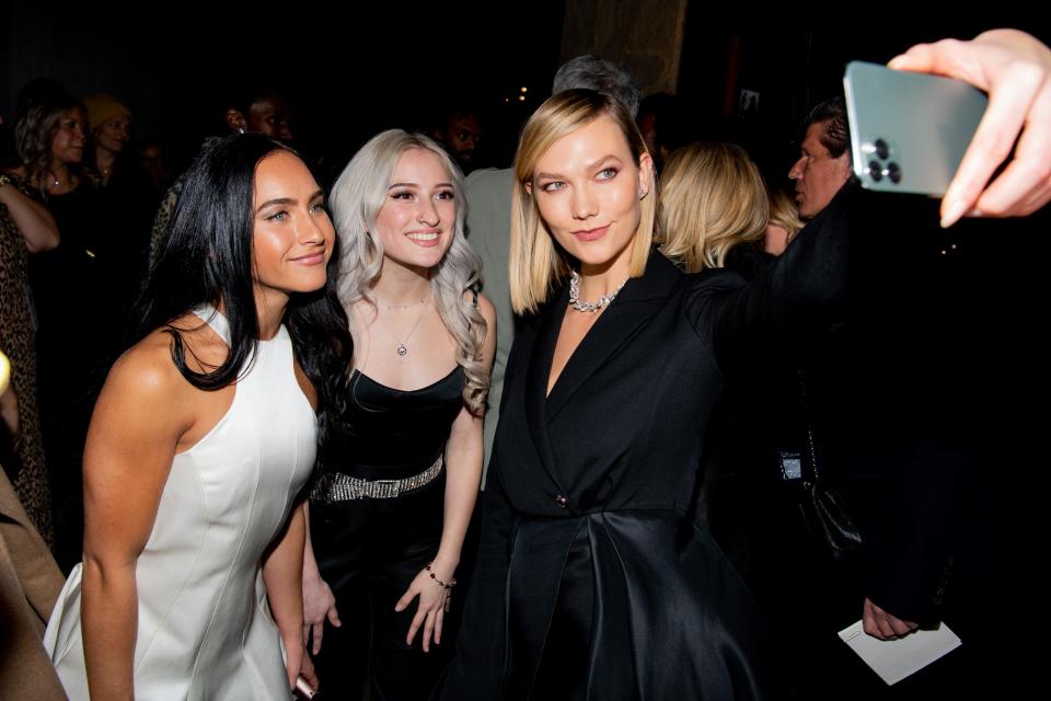 Gabi Butler, Lexi Brumback and Karlie Kloss snap a photo at Brandon Maxwell's Fall/Winter 2020 New York Fashion Week show on Feb. 6, 2020 in New York City.