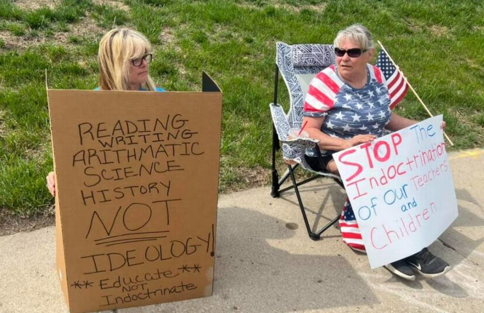 Johnson County Republicans Shay LaVanier, left, and Debbie Detmer showed up to counterprotest at Shawnee Mission North and stand in support of teacher Caedran Sullivan.