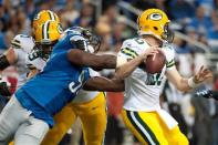 Detroit Lions defensive end Ezekiel Ansah (94) sacks Green Bay Packers quarterback Matt Flynn (10) during the second quarter during a NFL football game on Thanksgiving at Ford Field. Mandatory Credit: Tim Fuller-USA TODAY Sports