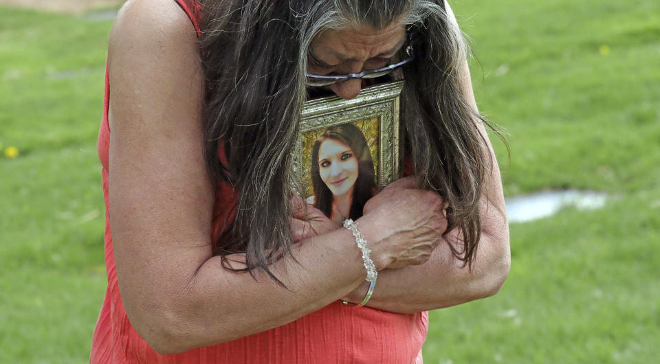 Melany Zoumadakis clutches a photo of her daughter, Tanna Jo Fillmore, on Friday, April 26, 2019, in Salt Lake City. Fillmore killed herself in the Duchesne County Jail in 2016, after repeatedly calling her mother, saying she was being denied her prescription medicines that had stabilized her. Her mother has filed suit. (AP Photo/Rick Bowmer)