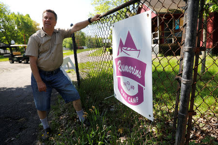 FILE PHOTO: Scott Rosmarin, owner and operator of Rosmarins Day Camp and Cottages, poses for a photograph at the Camp entrance in Monroe, New York, U.S., May 20, 2019. Picture taken May 20, 2019. REUTERS/Mike Segar
