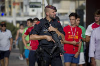 <p>An armed policeman grimaces while on patrol in Cambrils, Spain, Friday, Aug. 18, 2017. (Photo: Emilio Morenatti/AP) </p>