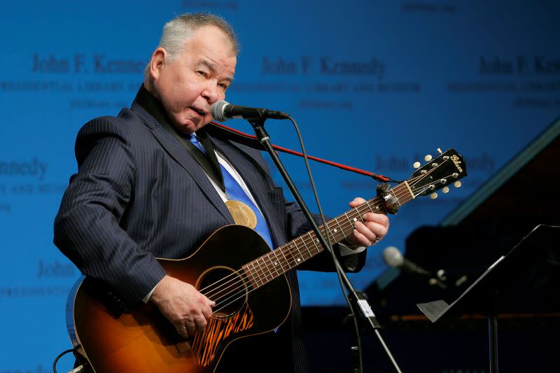 FILE PHOTO: Musician John Prine performs after accepting his PEN New England Song Lyrics of Literary Excellence Award during a ceremony at the John F. Kennedy Library in Boston