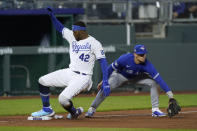 Kansas City Royals' Jorge Soler, left, beats the tag by Toronto Blue Jays third baseman Cavan Biggio to advance to third on a flyout by Michael A. Taylor during the fourth inning of a baseball game Thursday, April 15, 2021, in Kansas City, Mo. (AP Photo/Charlie Riedel)