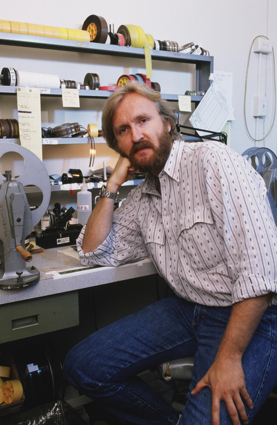 LOS ANGLES, CA - 1989:  Academy Award-winning film director, James Cameron, poses at an editing machine during a 1989 Los Angeles, California, photo portrait session. Cameron, the director of such box office hits as 