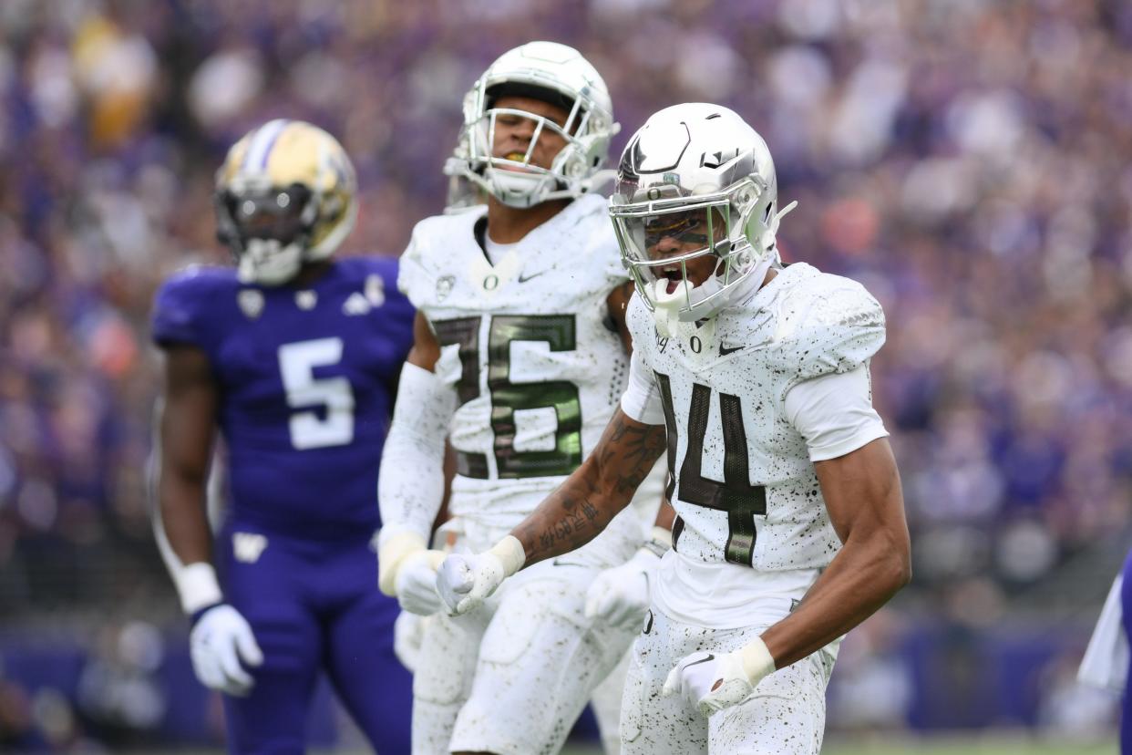 Oregon Ducks defensive back Khamari Terrell (14) celebrates after a defensive play against the Washington Huskies at Alaska Airlines Field at Husky Stadium Oct. 14 in Seattle.