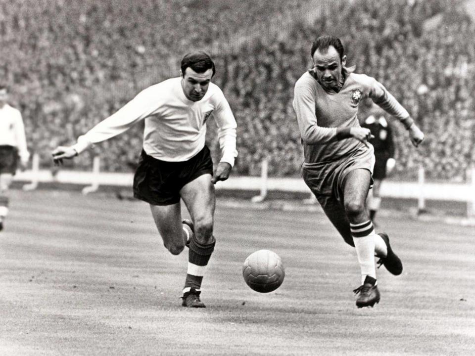 Jimmy Armfield in a race for the ball with Pepe during a friendly between England and Brazil at Wembley in May 1963 (Getty)