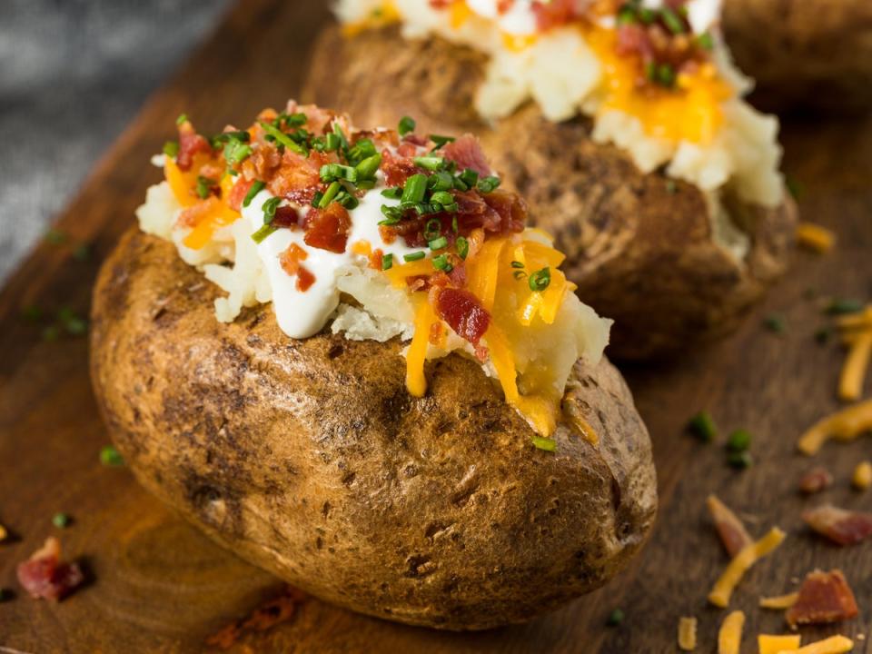 Loaded potato skins filled with cheese and bacon, made crispy in the air fryer (Getty)