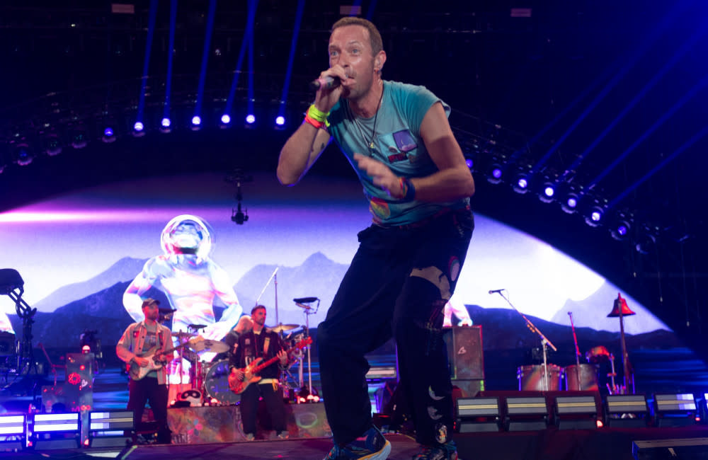 Chris Martin on stage at Glastonbury credit:Bang Showbiz