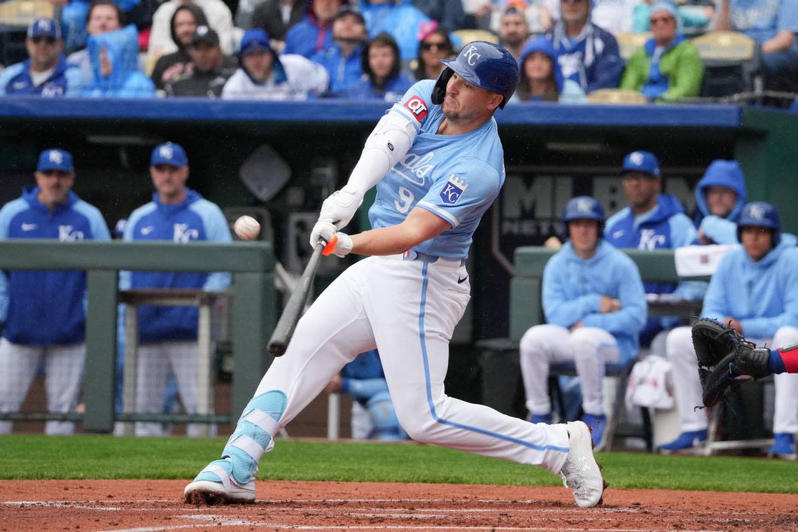 Kansas City Royals first baseman Vinnie Pasquantino hits a sac fly to center, driving in Bobby Witt Jr. from third during the first inning of Sunday’s game against the Texas Rangers at Kauffman Stadium.