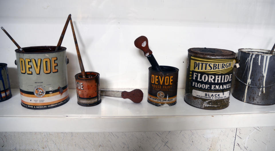 House paints and Pyrex basting syringes used by American Abstract Expressionist artist Jackson Pollock are displayed on a shelf in the artist's studio at the Pollock-Krasner House and Study Center on Saturday, Sept. 17, 2022, in The Springs, a hamlet in East Hampton, N.Y. The Pollock-Krasner House and Study Center is preserved and developed by the Stony Brook Foundation, a not-for-profit affiliate of Stony Brook University. (AP Photo/Pamela Hassell)