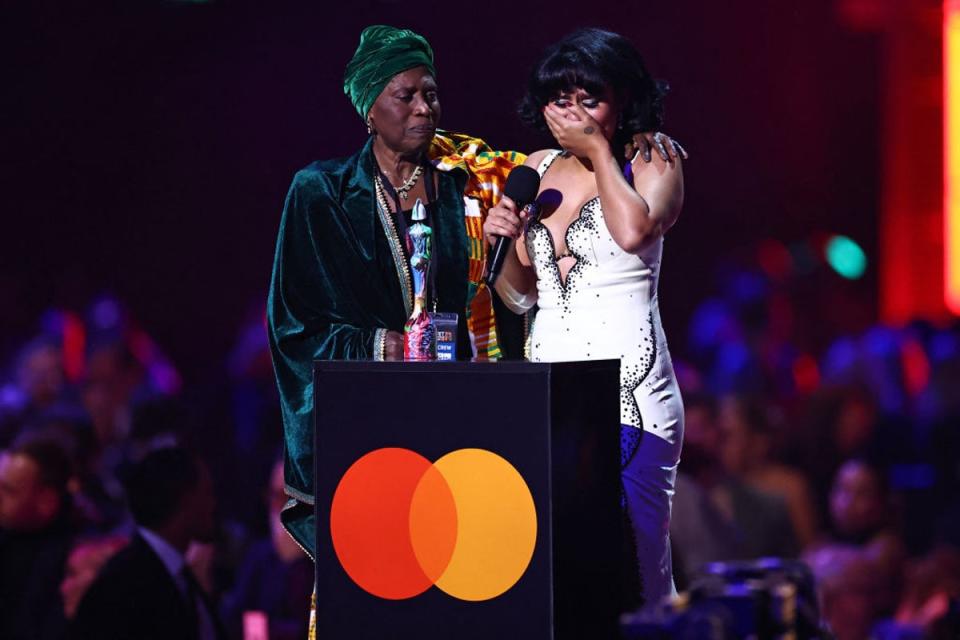 Raye become emotional as she brought her grandmother Agatha up on stage with her (AFP via Getty Images)