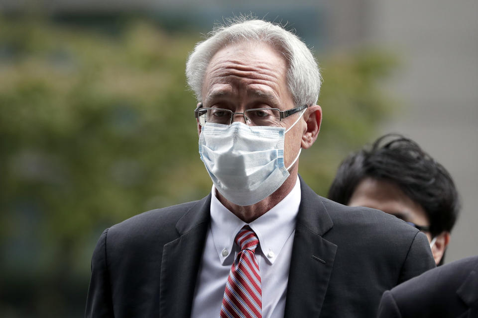 Former Nissan Motor Co. executive Greg Kelly arrives for the first trial hearing at the Tokyo District Court in Tokyo Tuesday, Sept. 15, 2020. The financial misconduct trial of Kelly opened Tuesday. Japanese prosecutors outlined allegations of what they said was a complex and clandestine scheme to pay former star executive Carlos Ghosn. (Kiyoshi Ota/Pool Photo via AP)