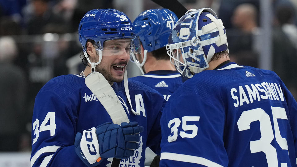 Toronto Maple Leafs centre Auston Matthews (34) and goaltender Ilya Samsonov (35) celebrate their win over the Winnipeg Jets (THE CANADIAN PRESS/Nathan Denette)