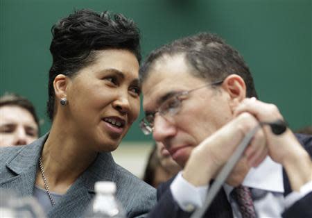 Cheryl Campbell (L), Senior Vice President of CGI Federal confers with Andrew Slavitt, Executive Vice President for Optum/QSSI during a House Energy and Commerce Committee hearing on the Patient Protection and Affordable Care Act on Capitol Hill in Washington, October 24, 2013. REUTERS/Jason Reed