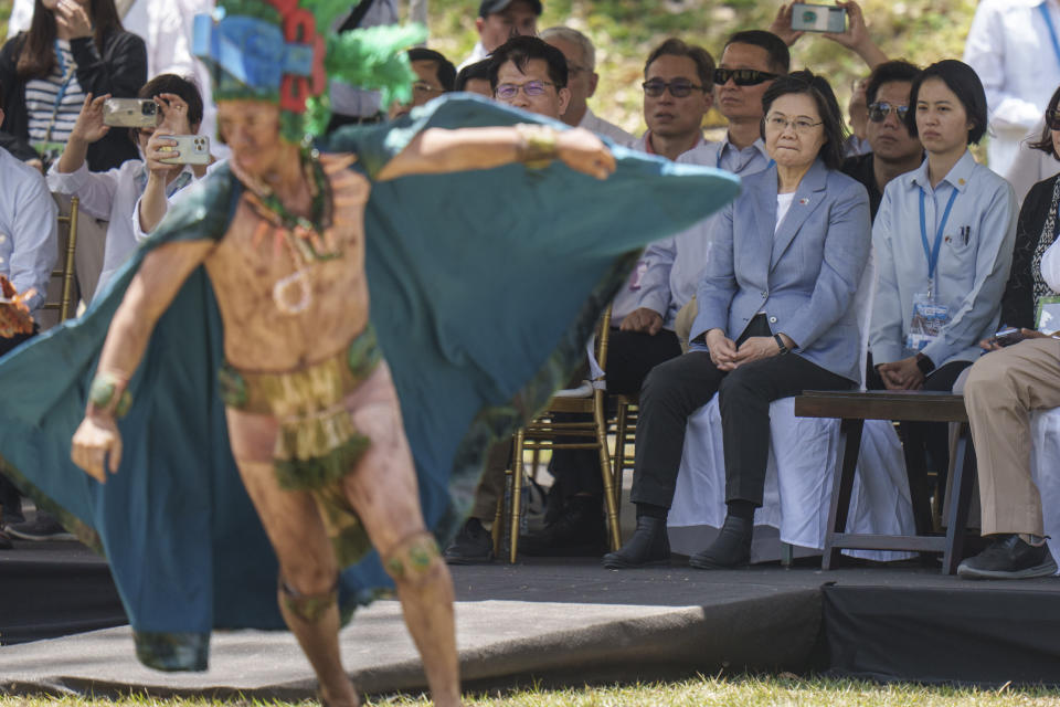 Taiwan's President Tsai Ing-wen, right center, watches a performance during a visit to the Mayan site Tikal, in Peten, Guatemala, Saturday, April 1, 2023. Tsai is in Guatemala for an official three-day visit. (AP Photo/Moises Castillo)
