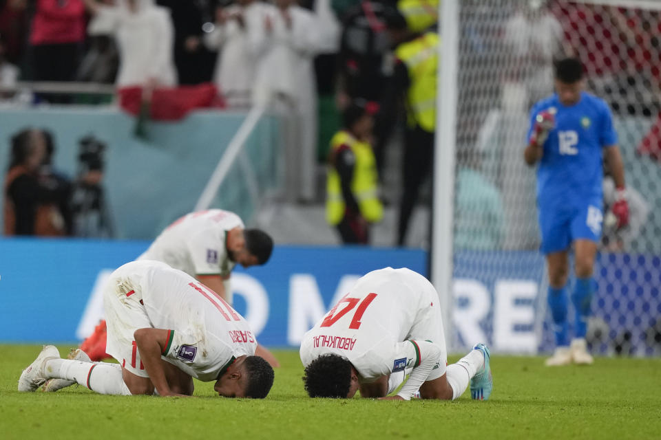 Morocco's Romain Saiss, back left, Abdelhamid Sabiri, front left, Zakaria Aboukhlal, front right, and goalkeeper Munir Mohamedi, back right, react after the World Cup group F soccer match between Belgium and Morocco, at the Al Thumama Stadium in Doha, Qatar, Sunday, Nov. 27, 2022. (AP Photo/Frank Augstein)