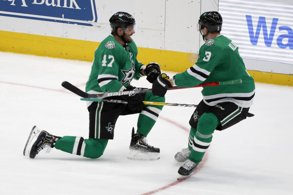 Dallas Stars right wing Alexander Radulov (47) celebrates scoring a goal with defenseman John Klingberg (3) in the third period of an NHL hockey game against the Vegas Golden Knights in Dallas, Monday, Nov. 25, 2019. (AP Photo/Tony Gutierrez)