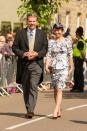 <p>Pippa opted for a printed dress, with a peplum waist, by Tabitha Webb for the wedding of the Duke of Northumberland’s daughter Lady Melissa Percy, 26 and Thomas van Straubenzee, 30 in Alnwick. Pippa, pictured here with her father Michael Middleton, completed the look with a feather hat and simple, black pumps.<em> (Photo: PA)</em> </p>