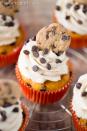 <p>This sweet treat brings you the best flavors ever: pumpkin and cookie dough. A mini chocolate chip cookies seals the deal. </p><p><strong> <a href="https://www.yourcupofcake.com/2016/10/pumpkin-cookie-dough-cupcakes.html" rel="nofollow noopener" target="_blank" data-ylk="slk:Get the recipe at Your Cup of Cake;elm:context_link;itc:0;sec:content-canvas" class="link ">Get the recipe at Your Cup of Cake</a>.</strong></p>