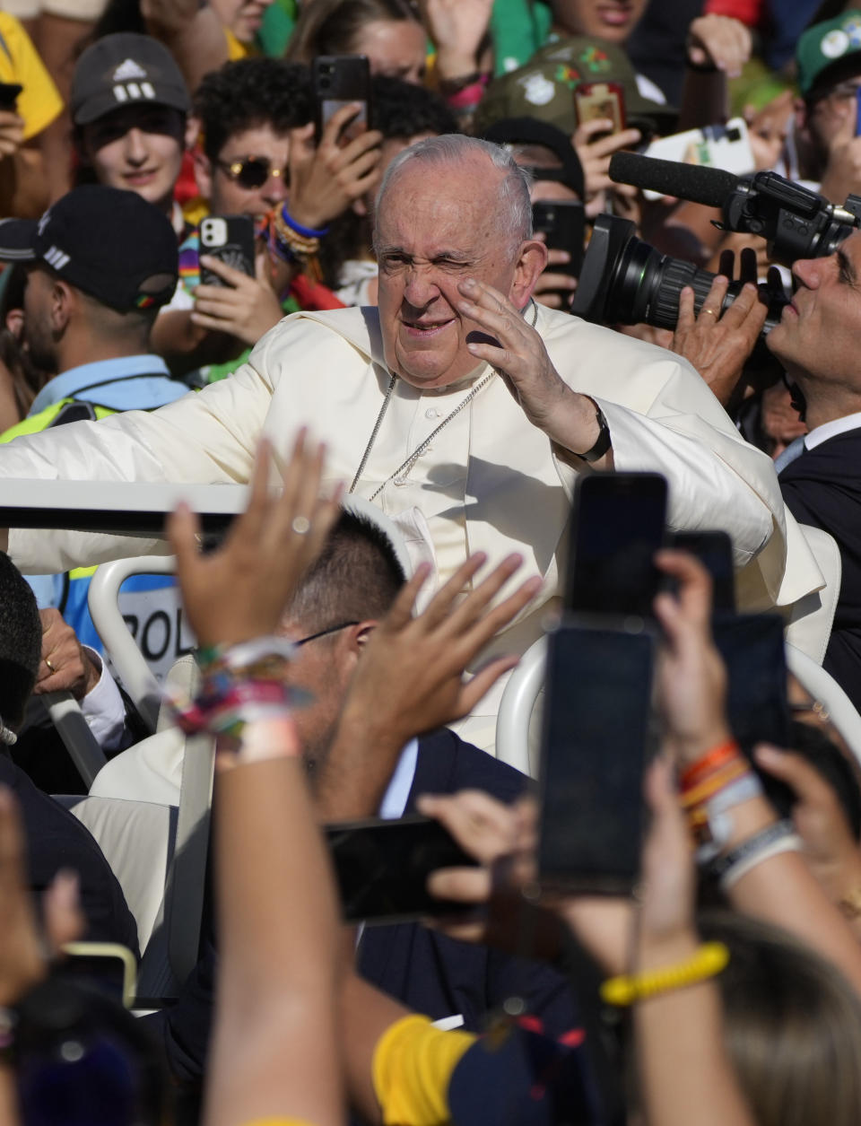 Pope Francis waves on arrival to take part in a via crucis (Way of the Cross) at the Eduardo VII Park with young people in Lisbon, Friday, Aug. 4, 2023. Pope Francis is on the third day of a five-day pastoral visit to Portugal that includes the participation at the 37th World Youth Day, and a pilgrimage to the holy shrine of Fatima. (AP Photo/Gregorio Borgia)