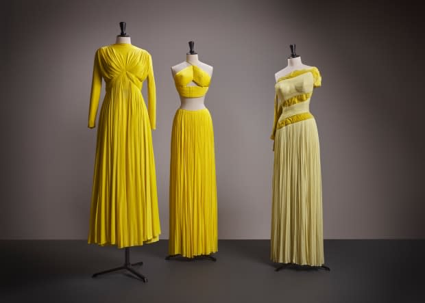 Bright and shining from the corner of the room, this trio of gowns flaunts the talent of Madame Grès across varying silhouettes.<p>Photo: Courtesy of SCAD</p>