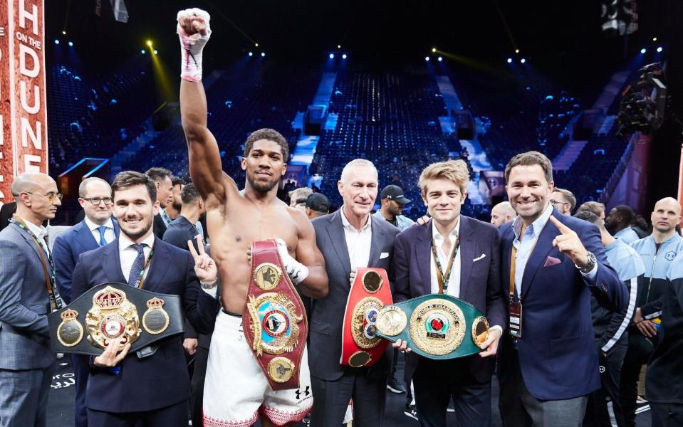 Joseph Markowski alongside Anthony Joshua and Eddie Hearn.