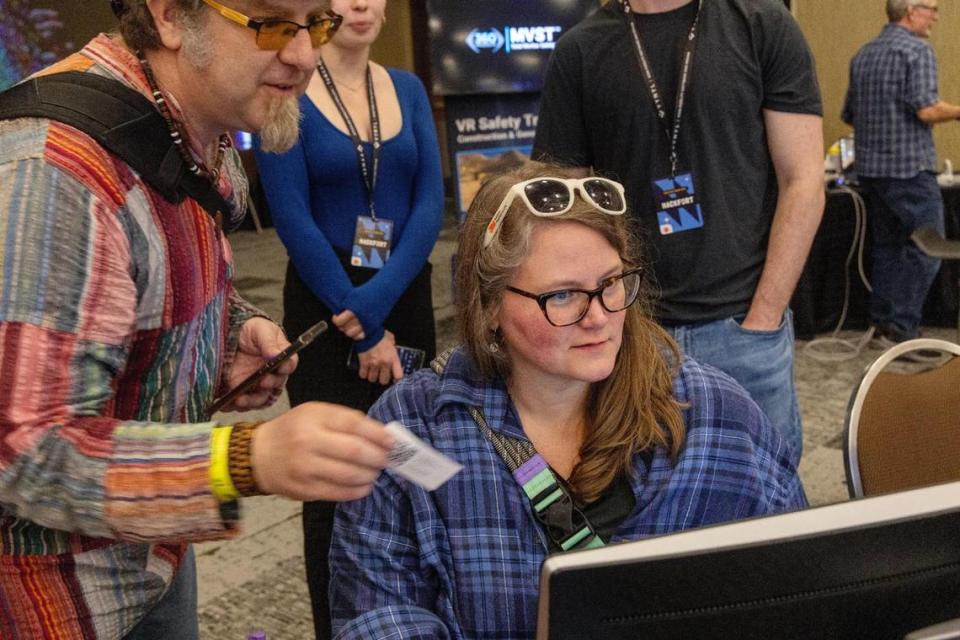 Jared Decker, of Salt Lake City, and Erynn Graf, of Boise, try the Cyberdome Security Challenge at Hackfort on Thursday. The event was sponsored by Boise State University’s Institute for Pervasive Cybersecurity.