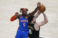 Atlanta Hawks forward Danilo Gallinari (8) shoots and scores against Oklahoma City Thunder forward Luguentz Dort (5) during the second half of an NBA basketball game on Thursday, March 18, 2021, in Atlanta. (AP Photo/Brynn Anderson)