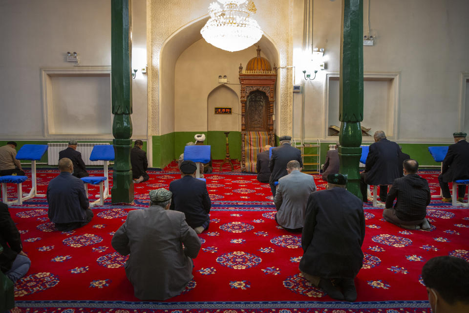 Uyghurs and other members of the faithful pray during services at the Id Kah Mosque in Kashgar in western China's Xinjiang Uyghur Autonomous Region, as seen during a government organized visit for foreign journalists on April 19, 2021. Under the weight of official policies, the future of Islam appears precarious in Xinjiang, a remote region facing Central Asia in China's northwest corner. Outside observers say scores of mosques have been demolished, which Beijing denies, and locals say the number of worshippers is on the decline. (AP Photo/Mark Schiefelbein)