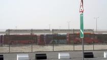 In this photo taken from video, a view of a metro station and a bus stop are seen in the fan village in Doha, Qatar, Wednesday, Nov. 9, 2022. Qatar on Wednesday unveiled a 6,000-cabin fan village in an isolated lot near its international airport, an offering for housing toward the lower end of what's available for the upcoming World Cup just days away from starting. (AP Photo/Lujain Jo)