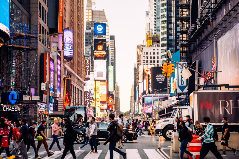 Crowds of people and busy traffic on Times Square