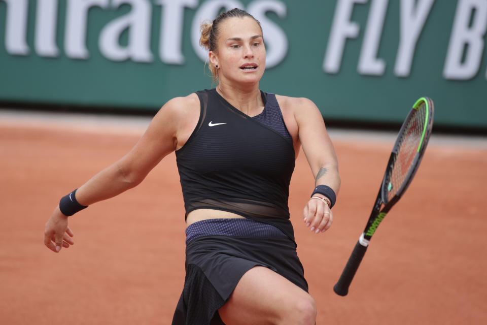 Aryna Sabalenka (pictured) kicks out at her tennis racquet after throwing it to the floor during her loss against Anastasia Pavlyuchenkova.