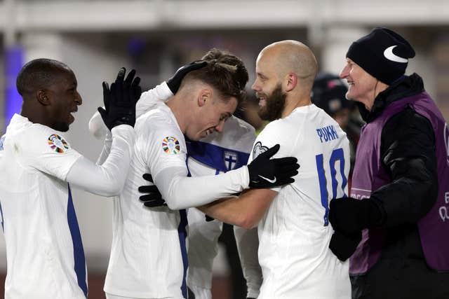 Finland’s Teemu Pukki, celebrates with teammates (Roni Rekomaa/AP)